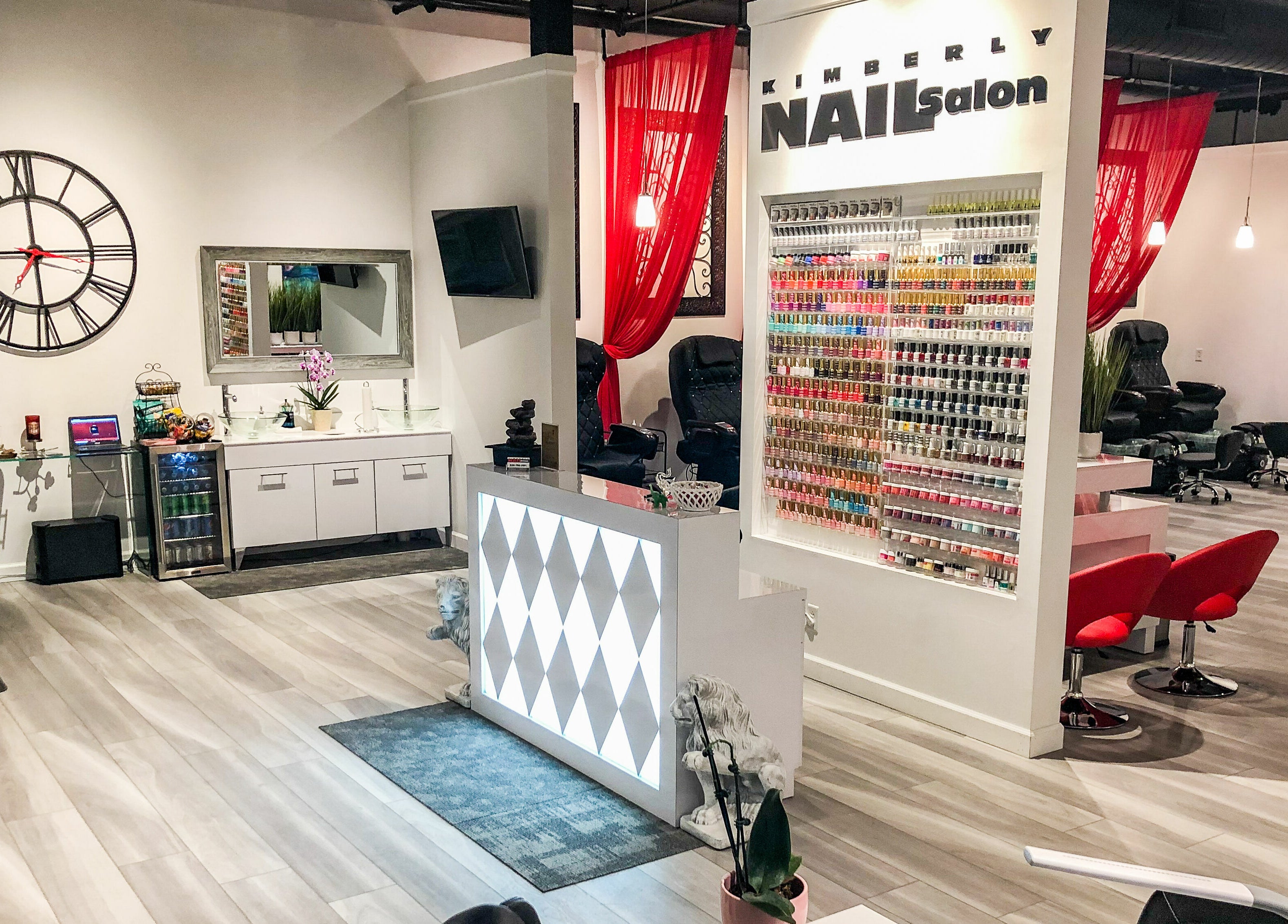 Interior of Kimberly Nail Salon in Kimberly, Wisconsin, US, featuring modern decor and a vibrant nail polish display.