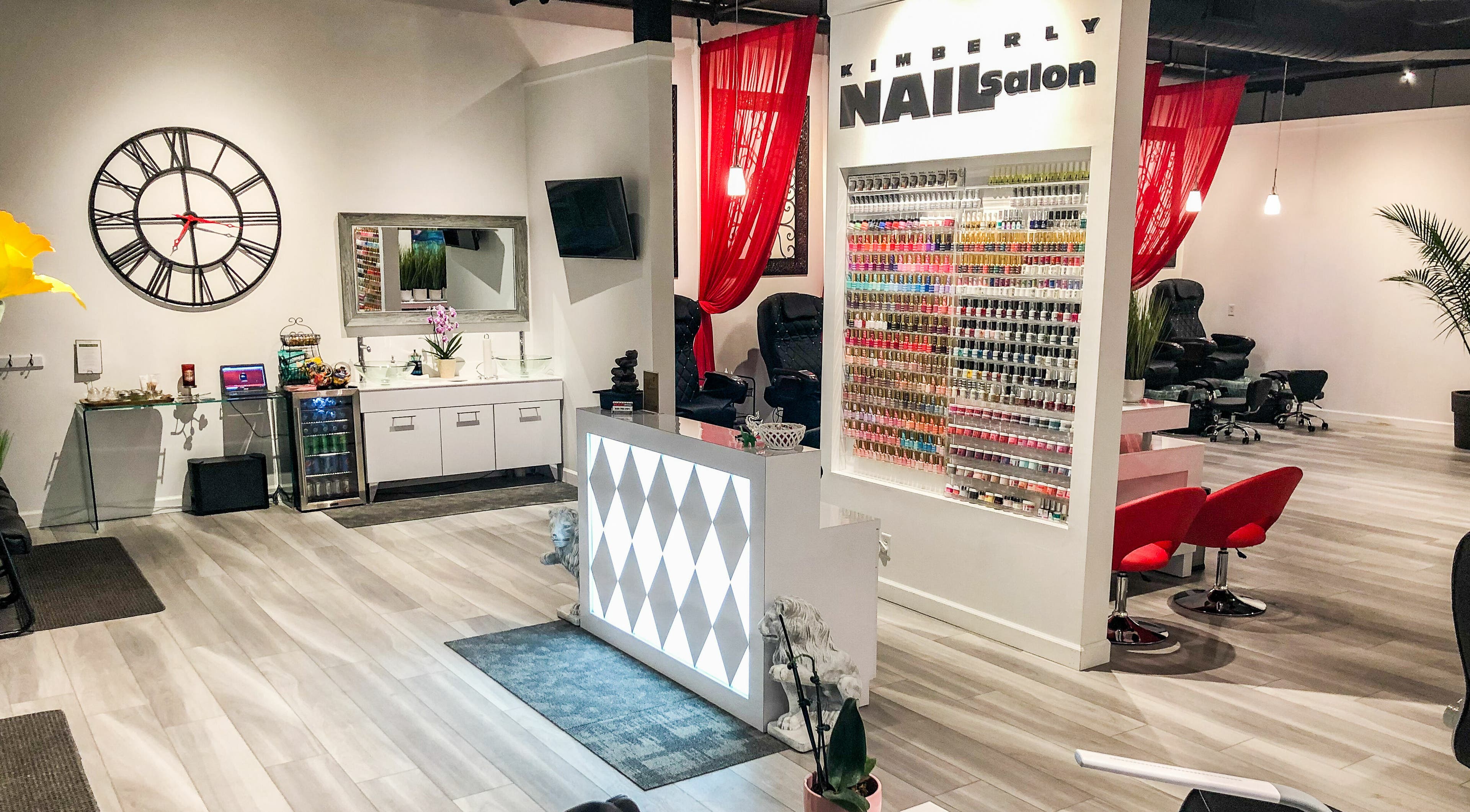 Interior of Kimberly Nail Salon in Kimberly, Wisconsin, US, featuring modern decor and a vibrant nail polish display.