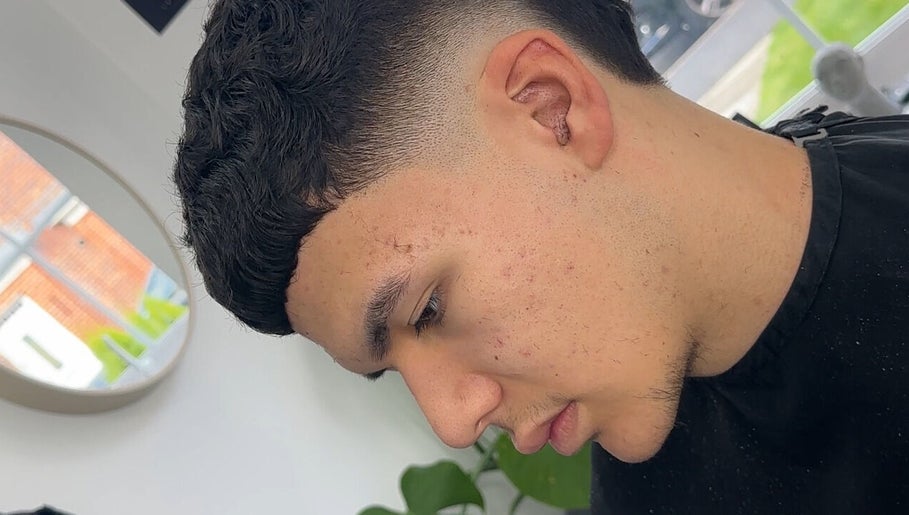 Stylish tapered haircut at U B U Creative, Lichfield, England, GB, showcasing precision and modern style.