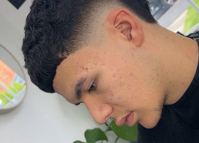 Stylish tapered haircut at U B U Creative, Lichfield, England, GB, showcasing precision and modern style.