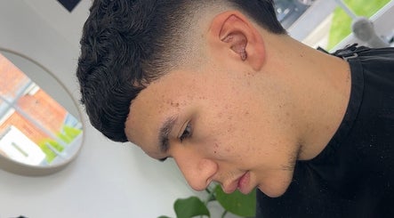 Stylish tapered haircut at U B U Creative, Lichfield, England, GB, showcasing precision and modern style.