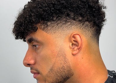 Men's curly fade haircut at U B U Creative in Lichfield, England, GB.