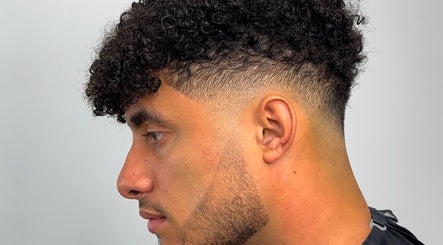 Men's curly fade haircut at U B U Creative in Lichfield, England, GB.
