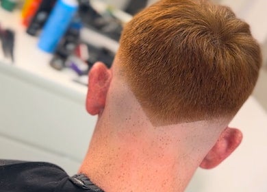 Precision haircut with a sharp fade at U B U Creative in Lichfield, England, GB.