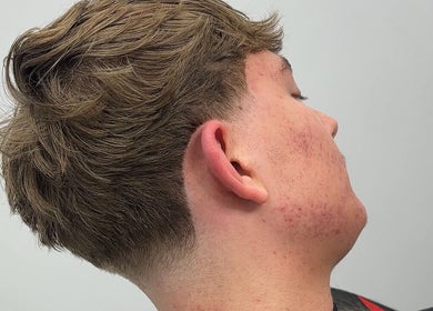 A stylish haircut at U B U Creative in Lichfield, England, GB, showcasing a precise fade and clean lines.