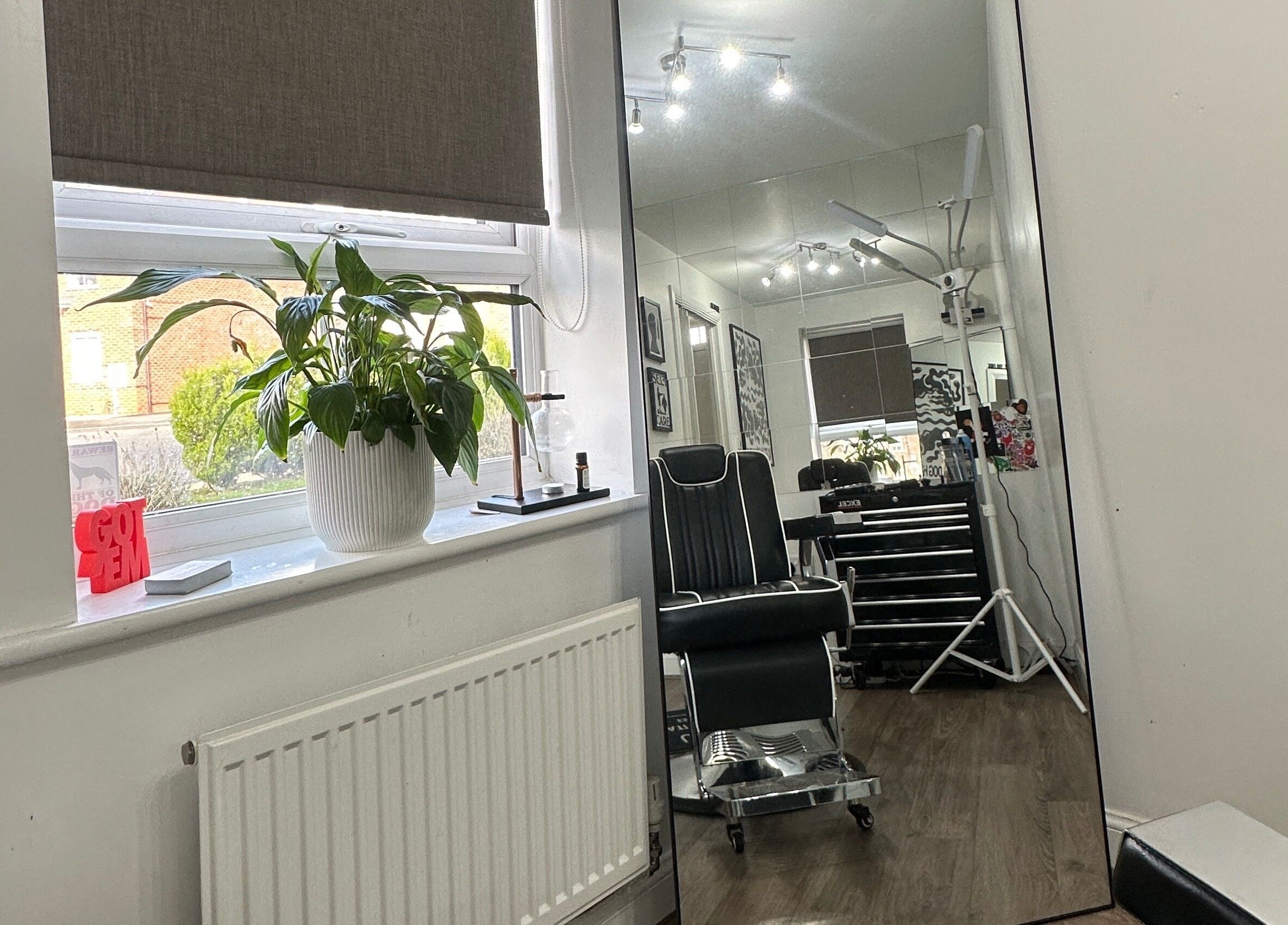 Modern interior of U B U Creative salon in Burntwood, England, with sleek furnishings and natural light.
