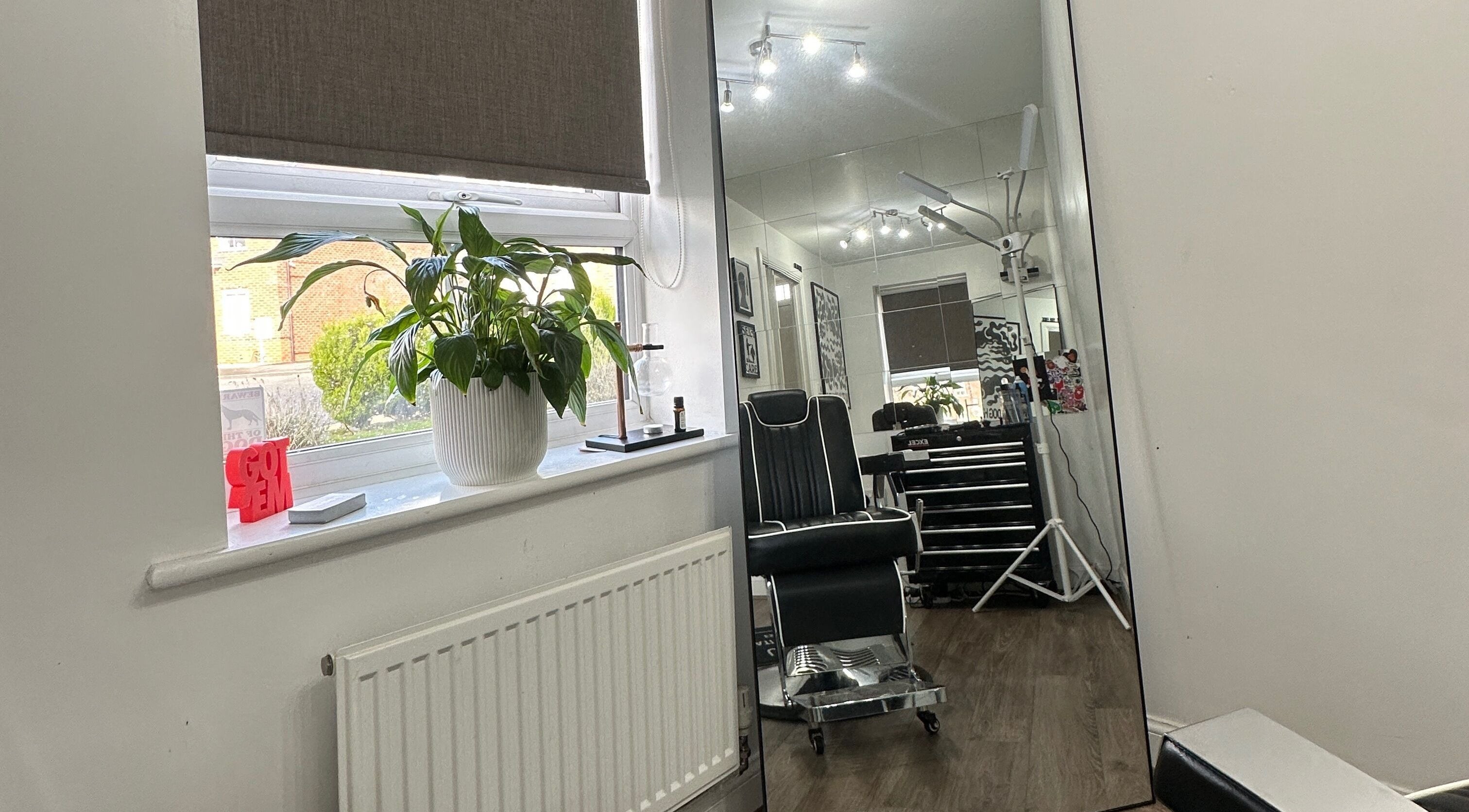 Modern interior of U B U Creative salon in Burntwood, England, with sleek furnishings and natural light.