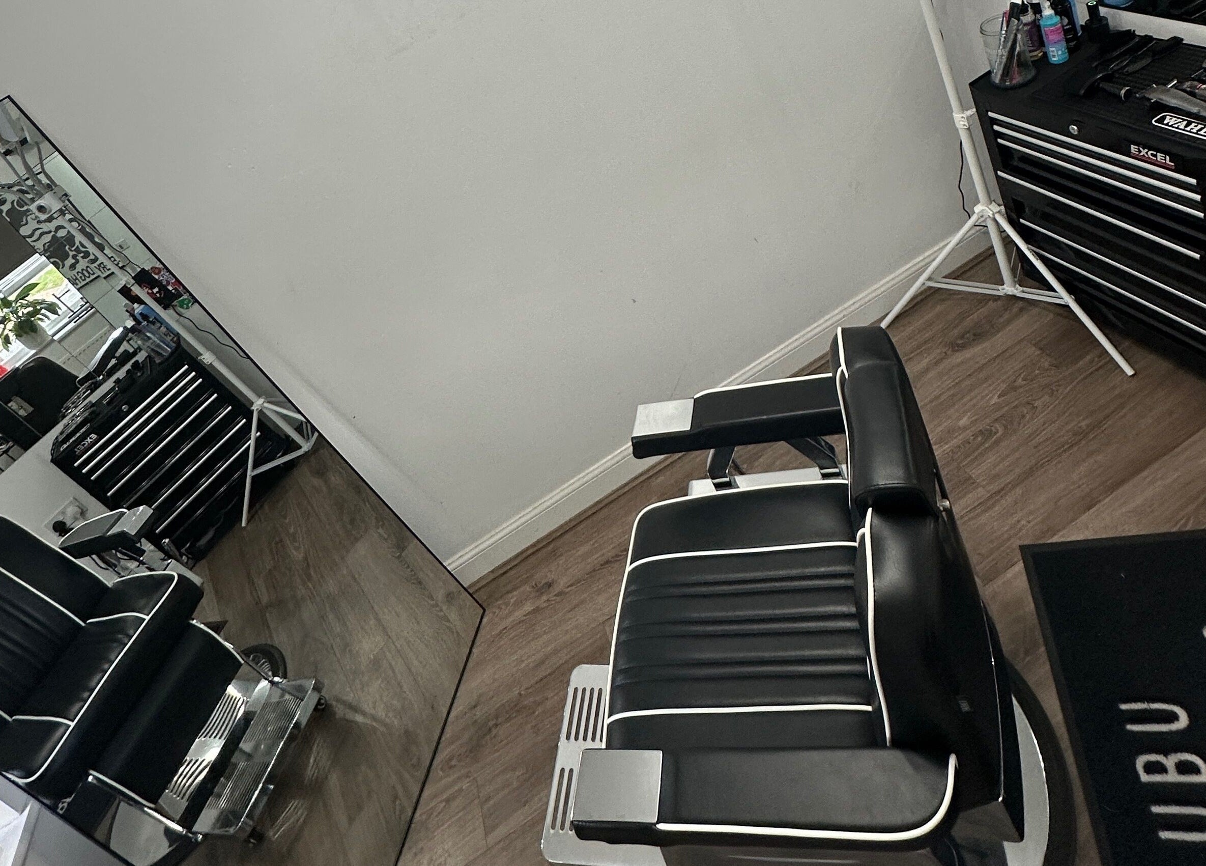 Modern barber chair at U B U Creative, Burntwood, England, GB offering sleek hair styling services.