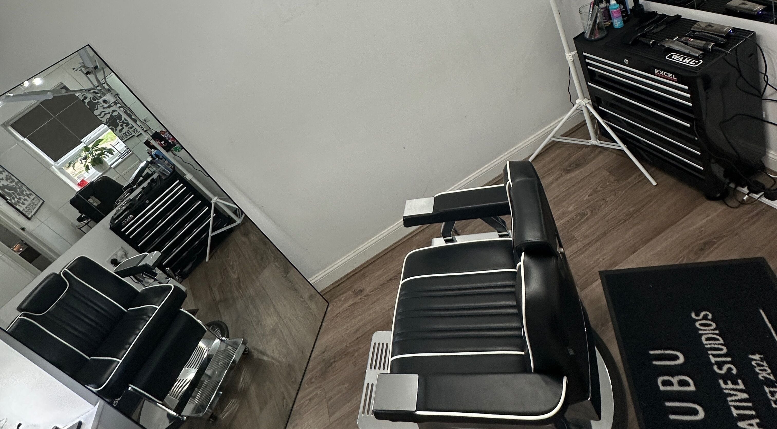 Modern barber chair at U B U Creative, Burntwood, England, GB offering sleek hair styling services.