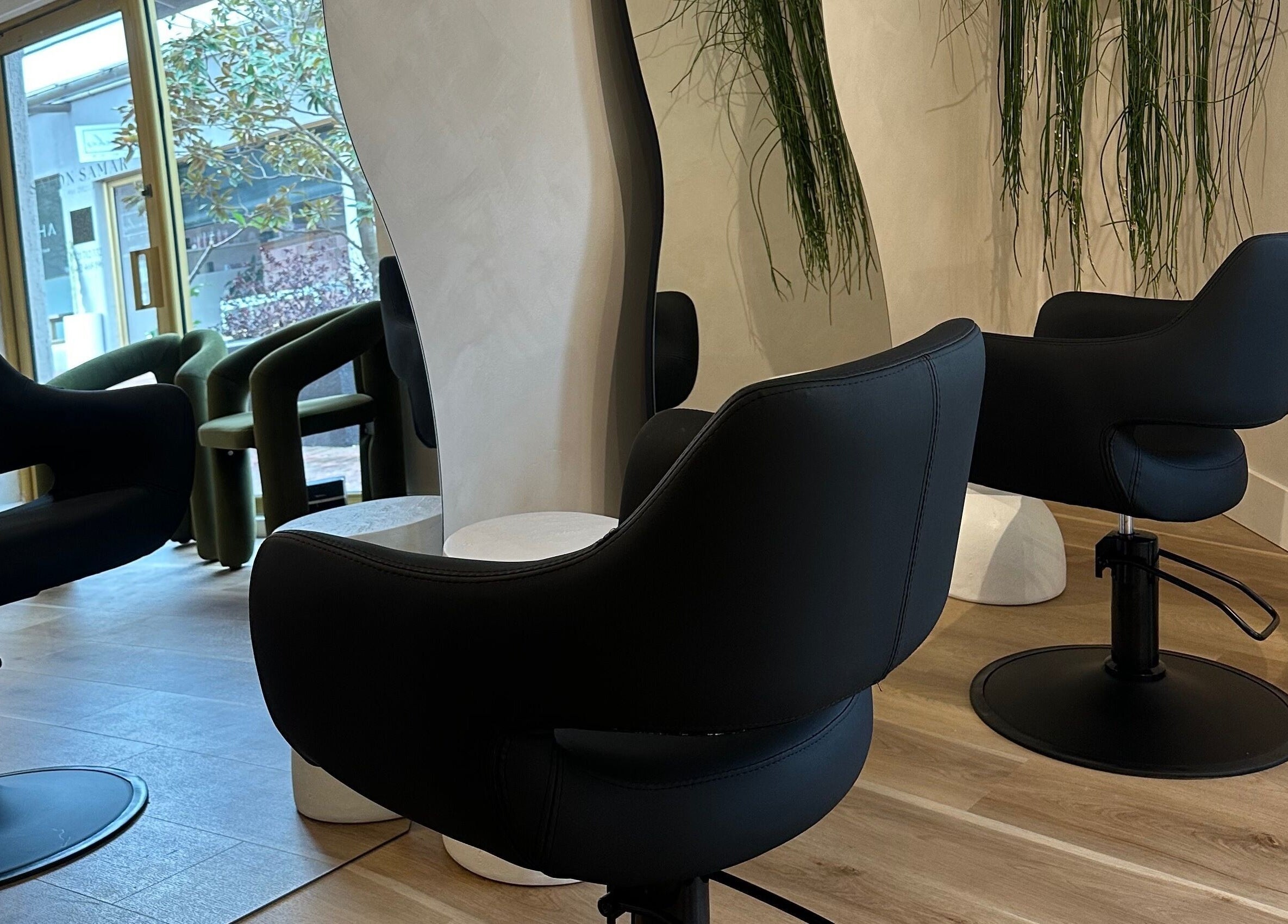Elegant salon chairs at Salon Samar, Newport, New South Wales, AU, creating a luxurious atmosphere.