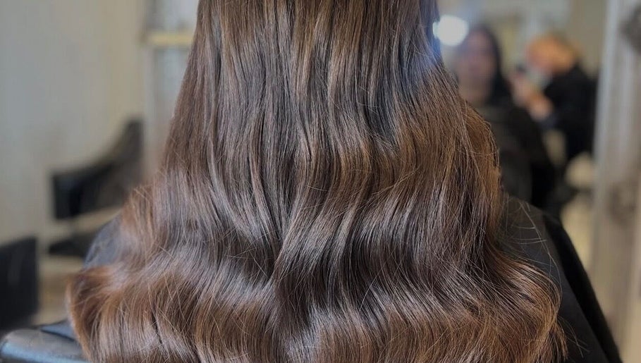 Beautiful wavy hairstyle at Styled by Court, Sutton, England, GB, showcasing rich, flowing hair artistry.