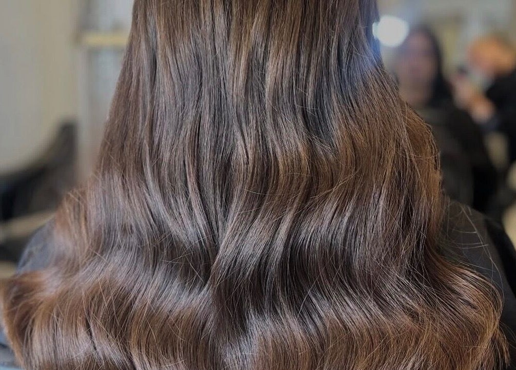 Beautiful wavy hairstyle at Styled by Court, Sutton, England, GB, showcasing rich, flowing hair artistry.