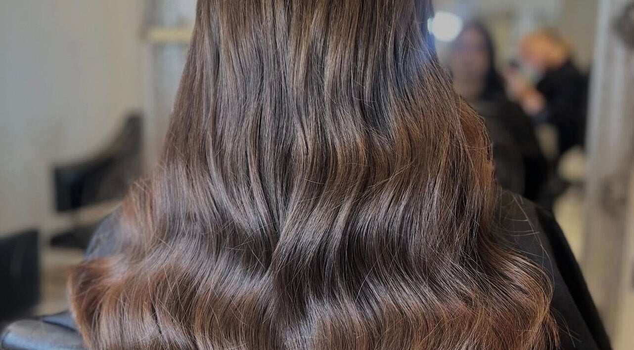 Beautiful wavy hairstyle at Styled by Court, Sutton, England, GB, showcasing rich, flowing hair artistry.