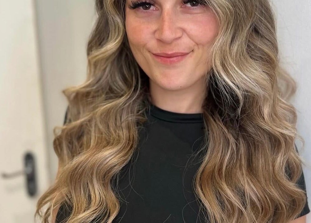 Styled by Court in Sutton, England offers stunning wavy hair transformations for a refreshed look.