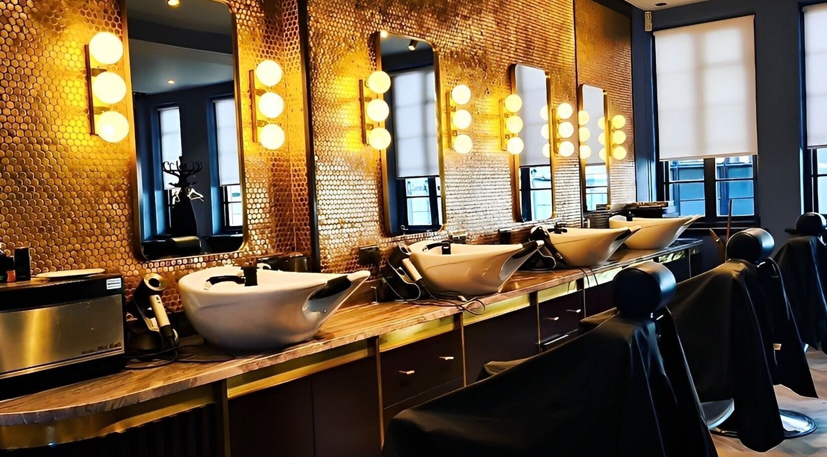 Sophisticated interior of Avanzato Grooming Lounge in London, England, GB with stylish salon stations.
