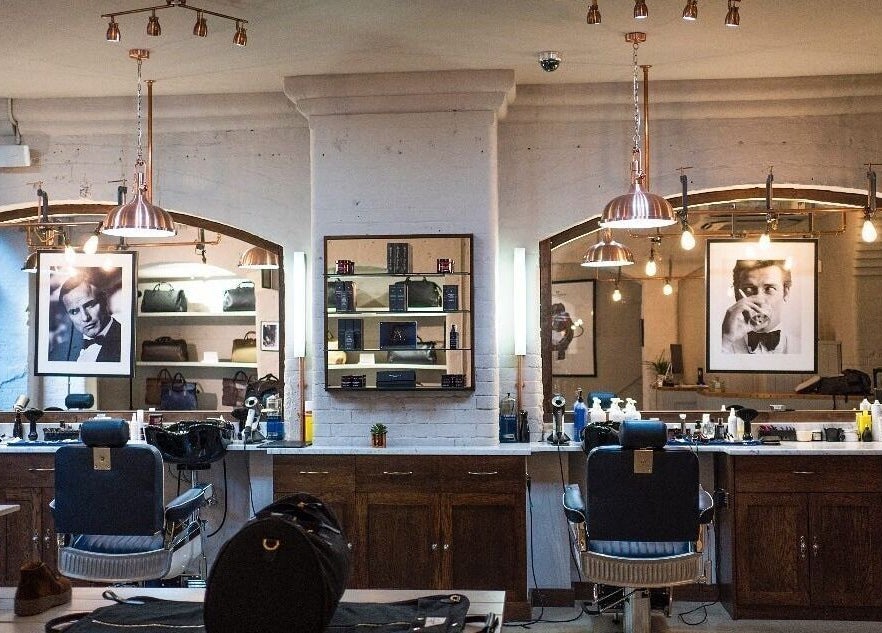 Interior of Avanzato Grooming Lounge, London, England, GB, showcasing classic barber chairs and elegant decor.