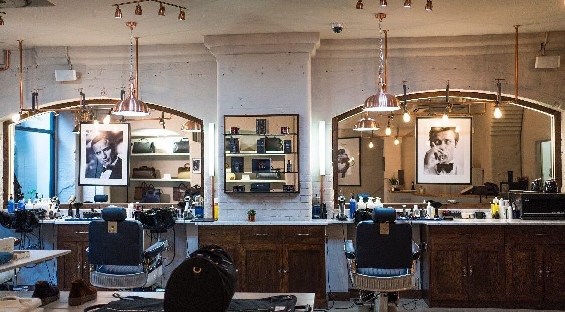 Interior of Avanzato Grooming Lounge, London, England, GB, showcasing classic barber chairs and elegant decor.