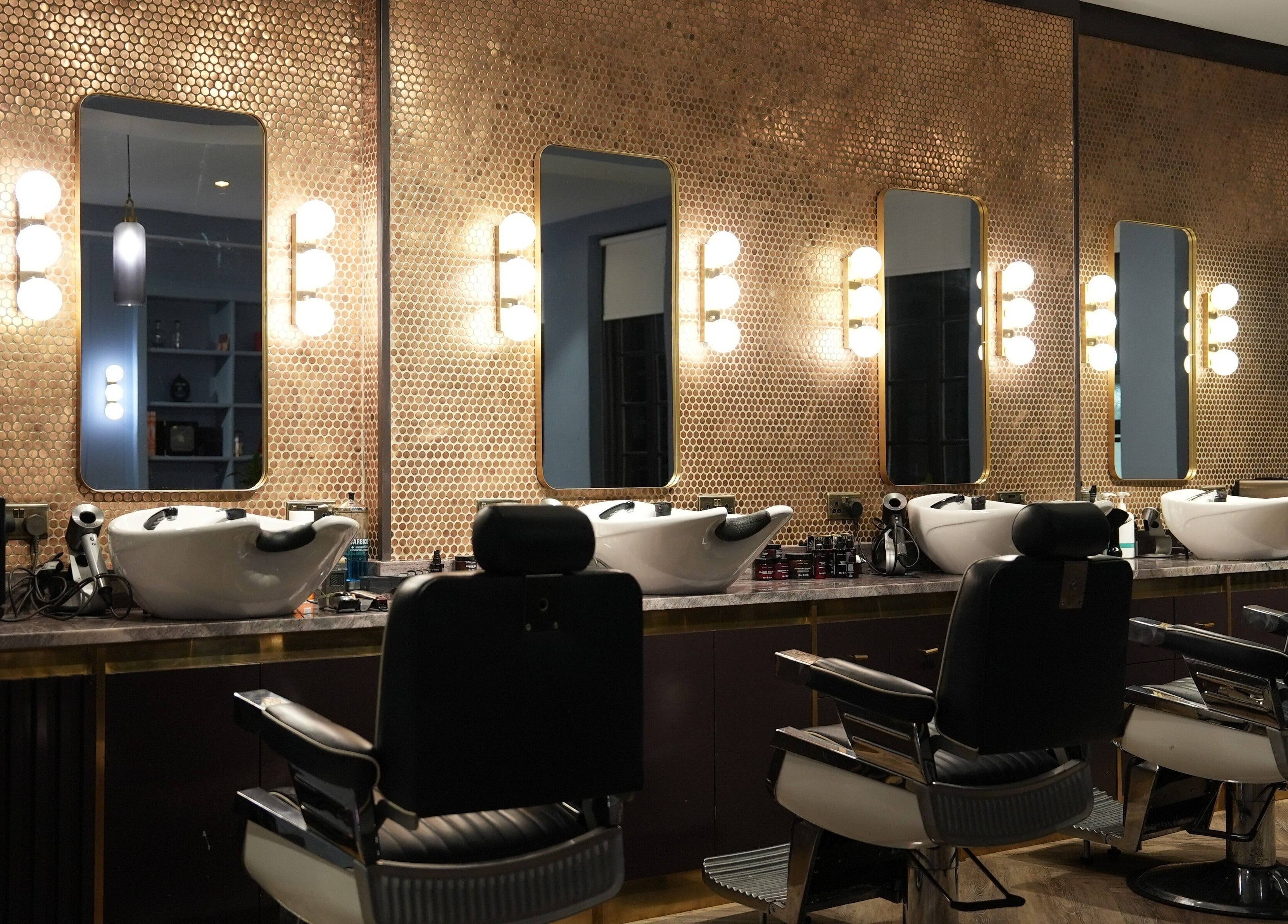 Sophisticated interior of Avanzato Grooming Lounge, London, England, GB with stylish barber chairs.