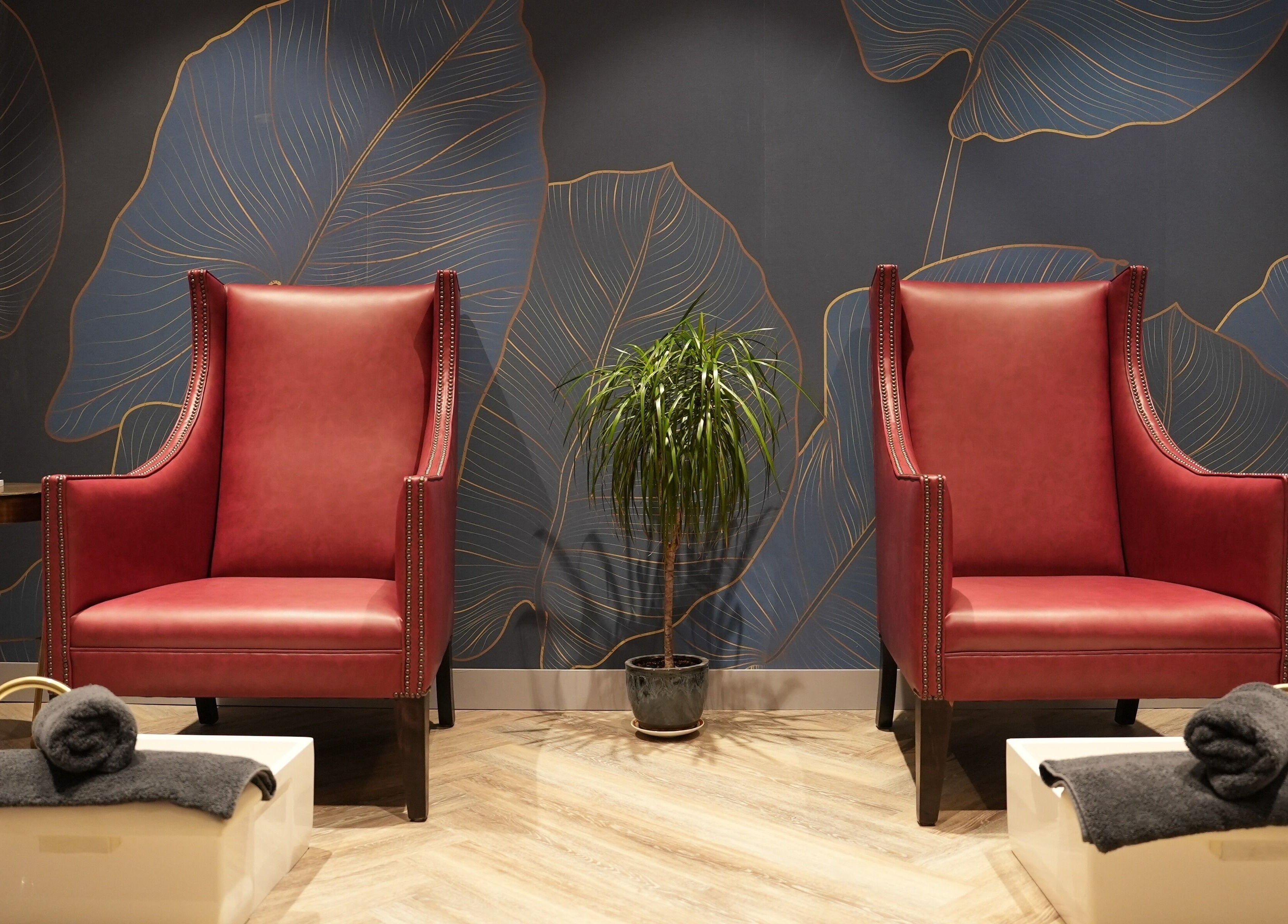 Elegant chairs at Avanzato Grooming Lounge, London, England, GB. Luxurious ambiance with plush seating.