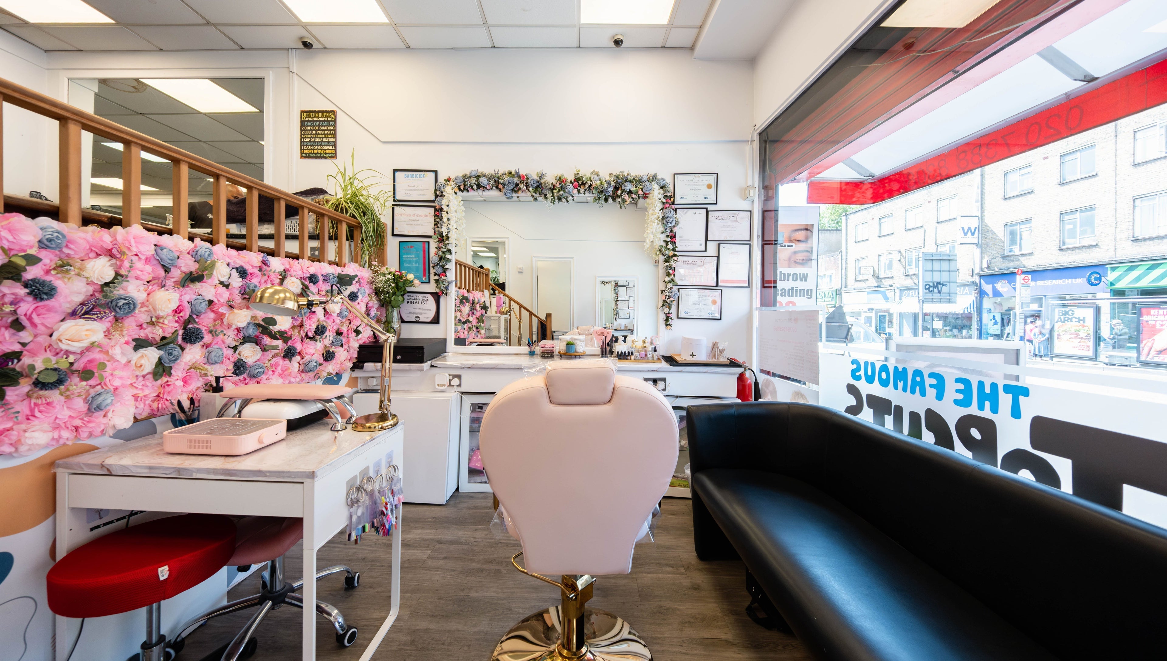 Chic interior of HR Glow Co, London, England, GB with floral decor and stylish seating.