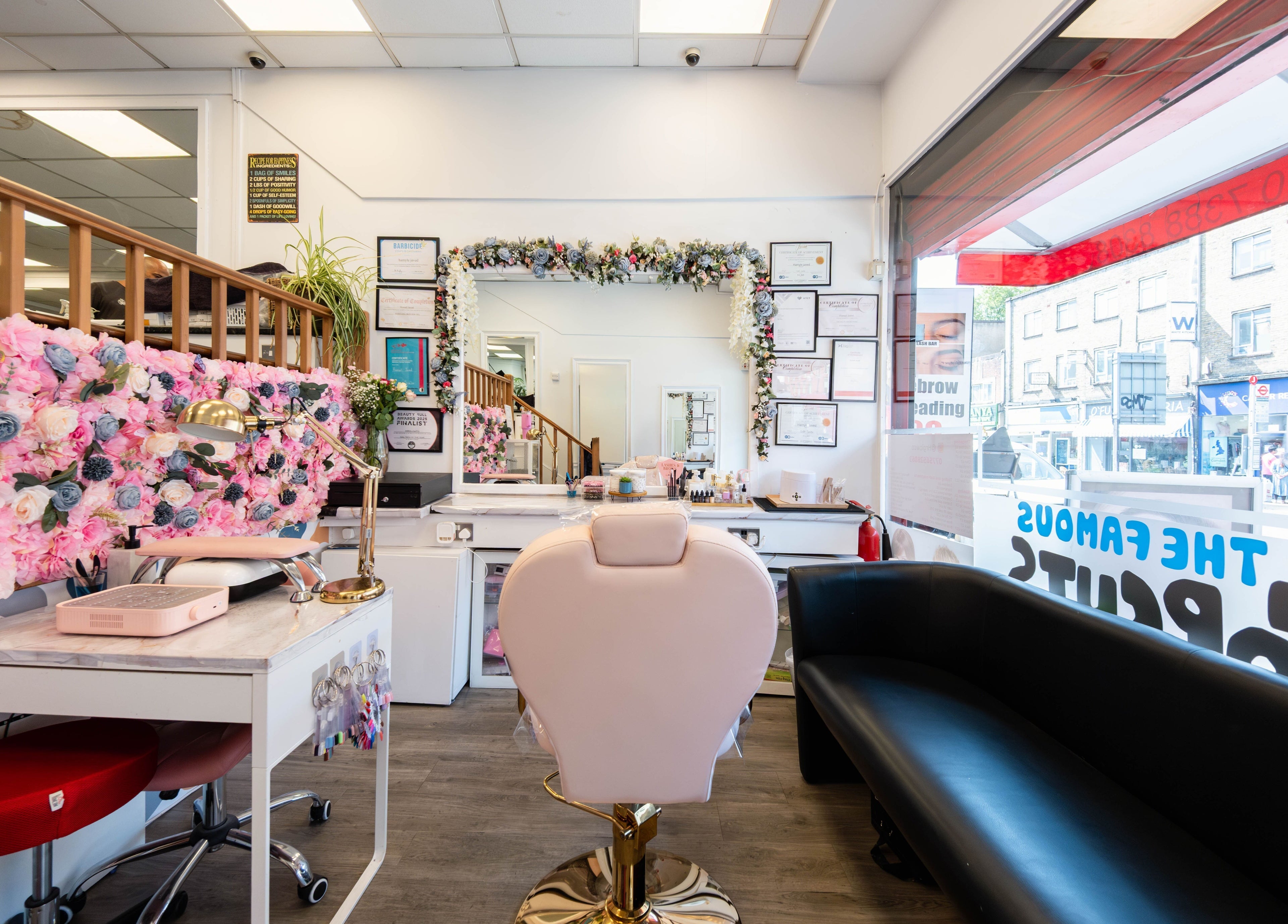 Chic interior of HR Glow Co, London, England, GB with floral decor and stylish seating.