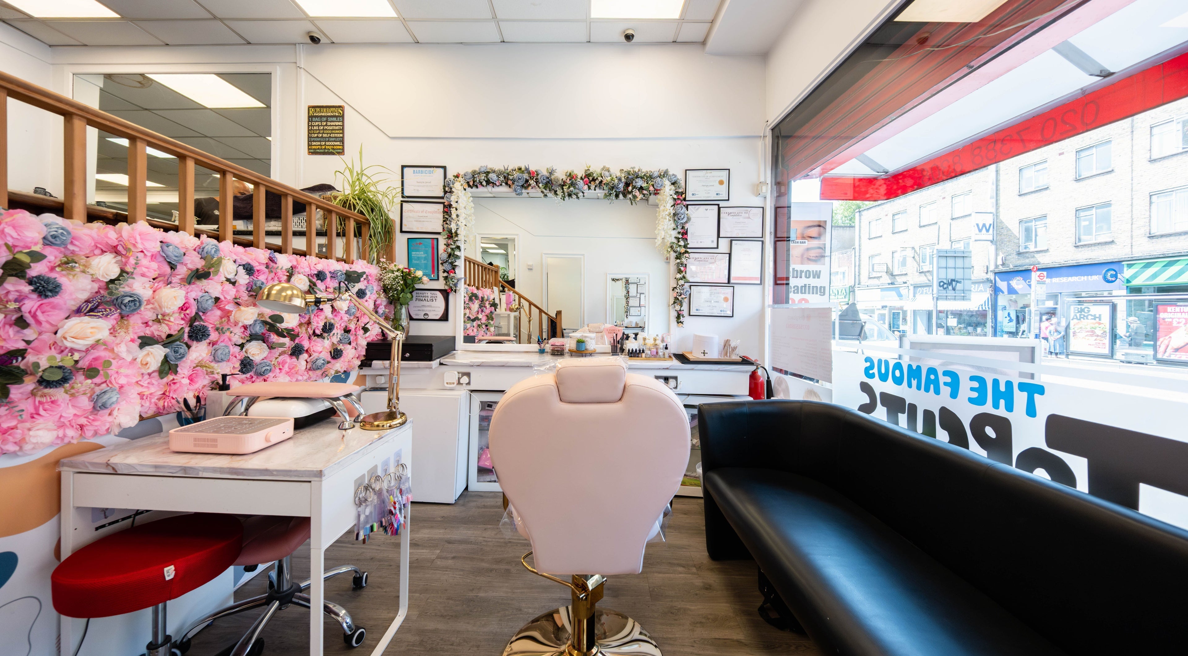 Chic interior of HR Glow Co, London, England, GB with floral decor and stylish seating.