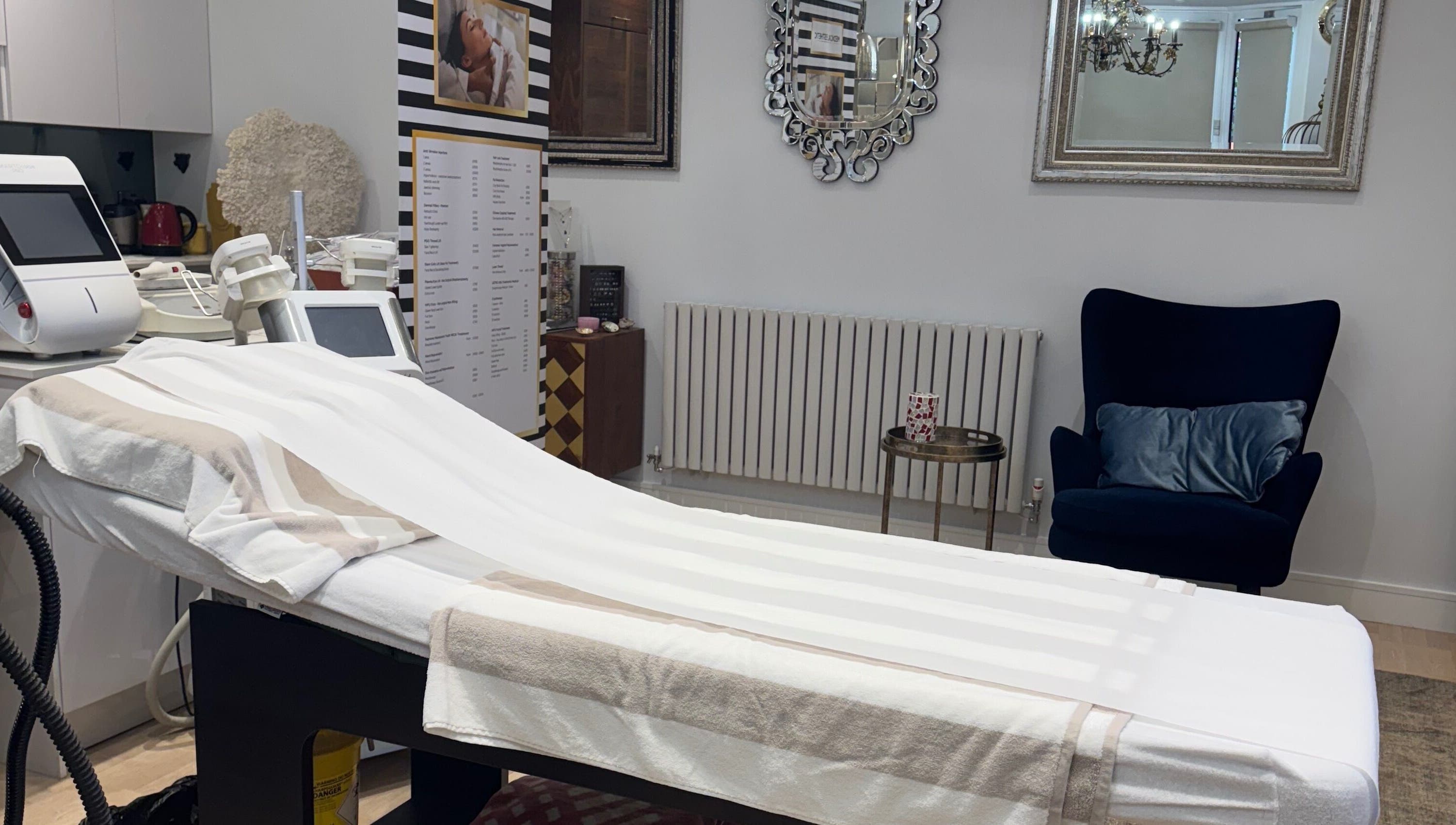 Elegant treatment room at Sabrina Aesthetic, London, England, GB, featuring a stylish chair and modern equipment.