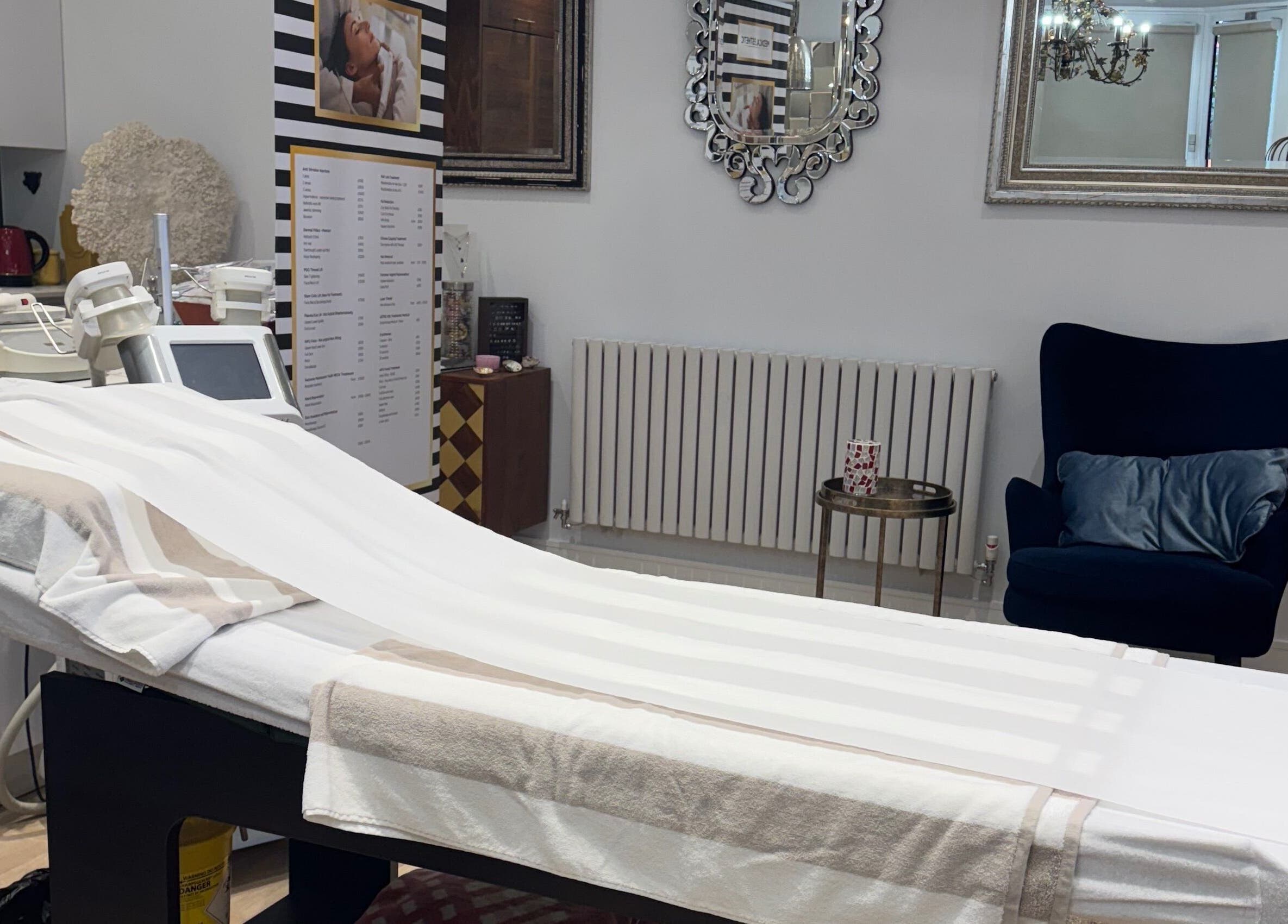 Elegant treatment room at Sabrina Aesthetic, London, England, GB, featuring a stylish chair and modern equipment.