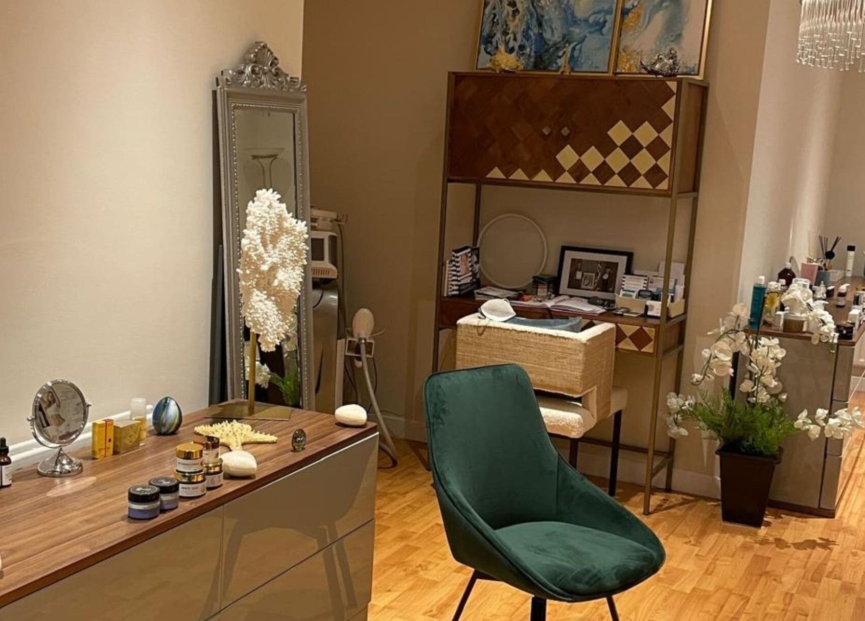 Elegant beauty setup at Sabrina Aesthetic, London, England, GB, featuring a plush chair and sleek decor.