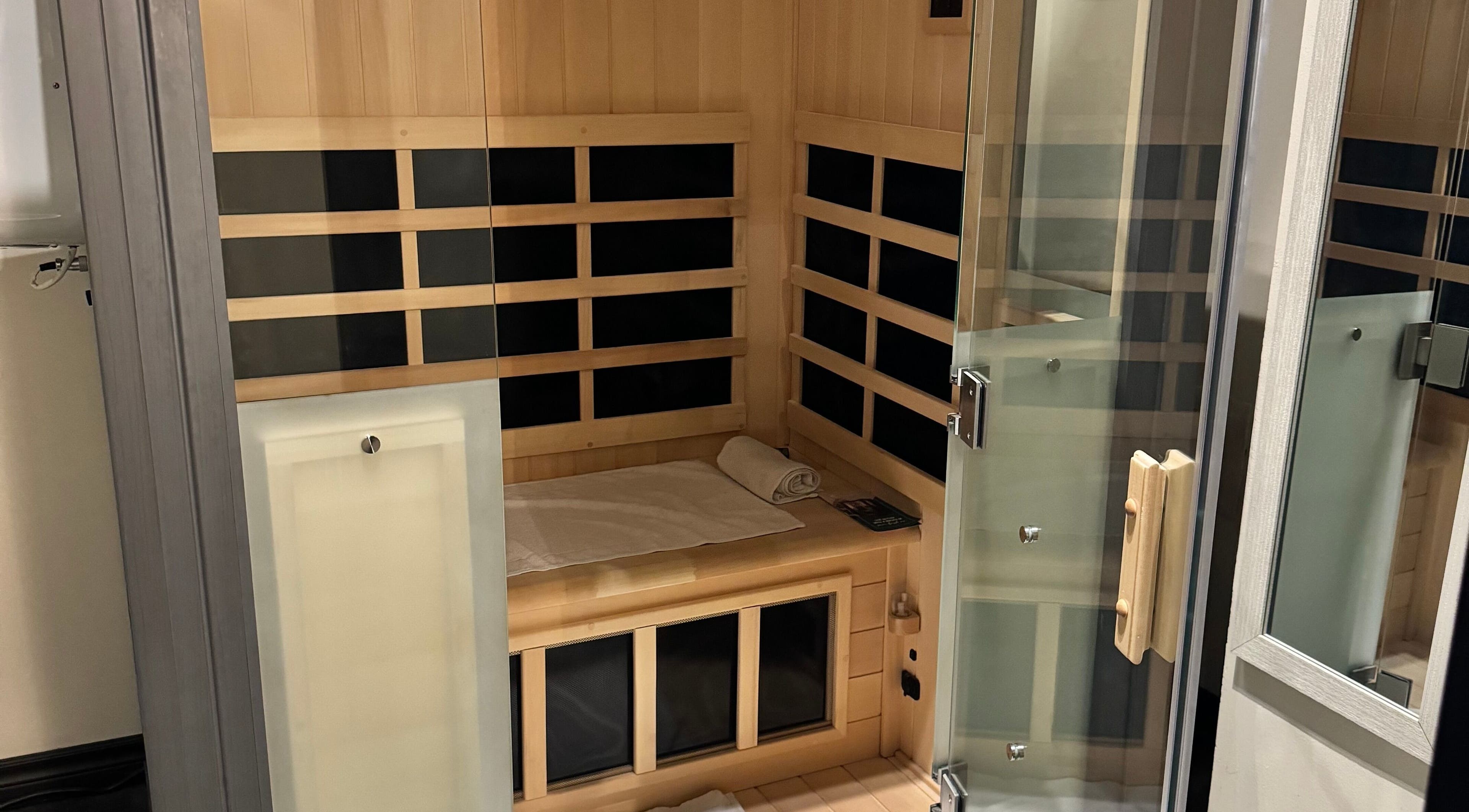 Luxurious sauna at Tuscany Studio, Hamilton, Ontario, CA, offering relaxation in a serene wood-lined space.