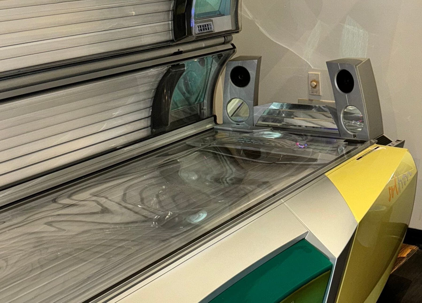 Modern tanning bed at Tuscany Studio in Hamilton, Ontario, CA offering premium sunless tanning experience.