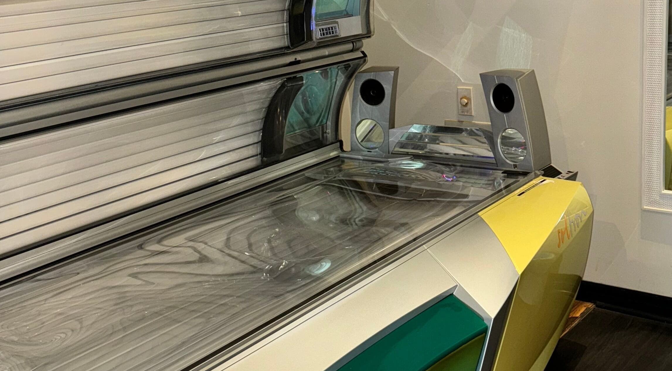 Modern tanning bed at Tuscany Studio in Hamilton, Ontario, CA offering premium sunless tanning experience.