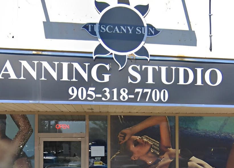 Exterior of Tuscany Studio in Hamilton, Ontario, CA, featuring bold signage and welcoming entrance.