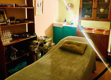 Relaxing spa room at Ethical Beauty, featuring a plush massage table in Bristol, England, GB.