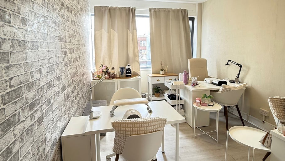 Chic interior of Aline Gallas Beauty in Dublin, County Dublin, IE showcasing elegant nail treatment stations.