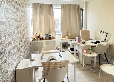 Chic interior of Aline Gallas Beauty in Dublin, County Dublin, IE showcasing elegant nail treatment stations.