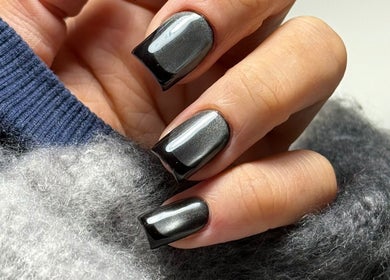 Elegant black Russian manicure at Legend nails, New York, New York, US showcases glossy nail art.