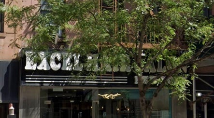 Entrance at Russian manicure - Legend nails in New York, New York, US with stylish signage.