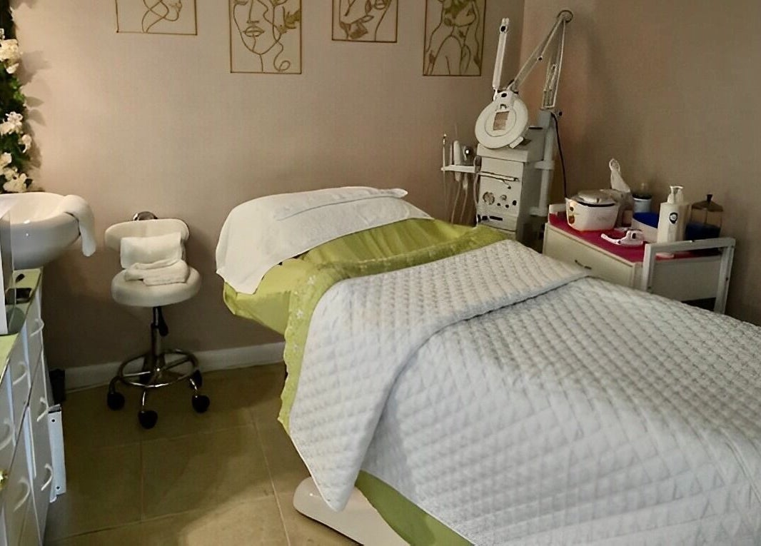 Cozy treatment room at Snipsky’s Salon and Spa, Freeport, Grand Bahama Island, BS, with massage bed and elegant decor.