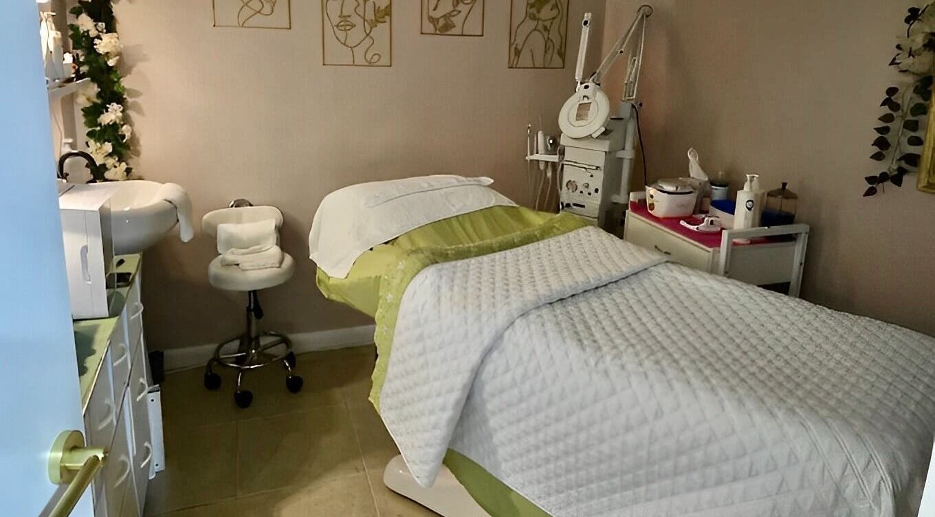 Cozy treatment room at Snipsky’s Salon and Spa, Freeport, Grand Bahama Island, BS, with massage bed and elegant decor.
