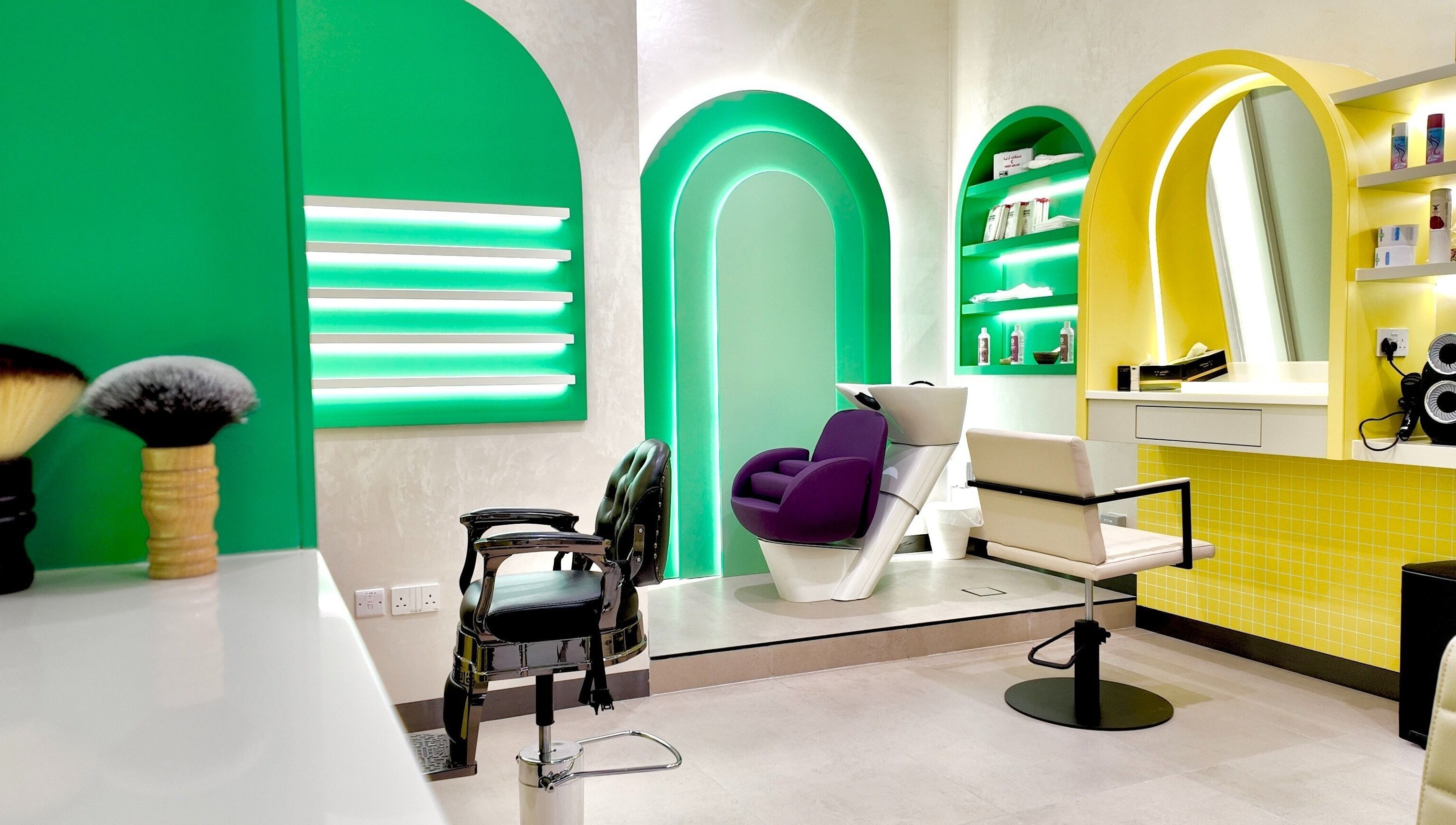 Modern salon interior at Stories Kids - Mohamed Bin Zayed, Abu Dhabi with colorful decor and styling chairs.