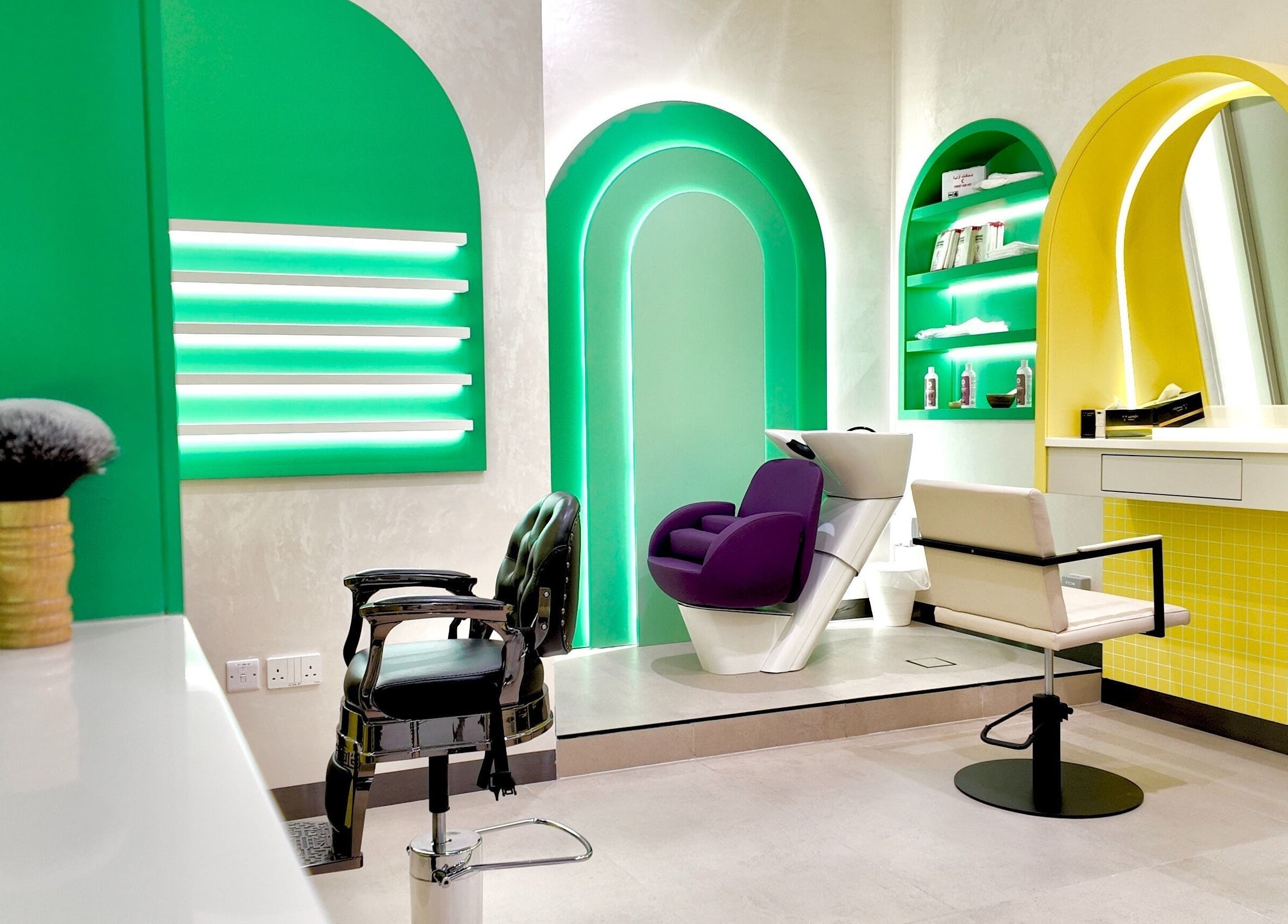 Modern salon interior at Stories Kids - Mohamed Bin Zayed, Abu Dhabi with colorful decor and styling chairs.