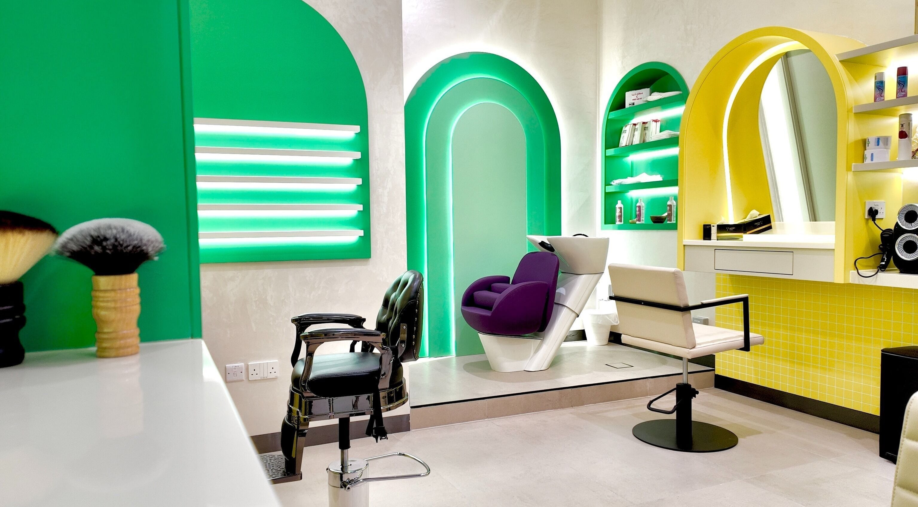 Modern salon interior at Stories Kids - Mohamed Bin Zayed, Abu Dhabi with colorful decor and styling chairs.