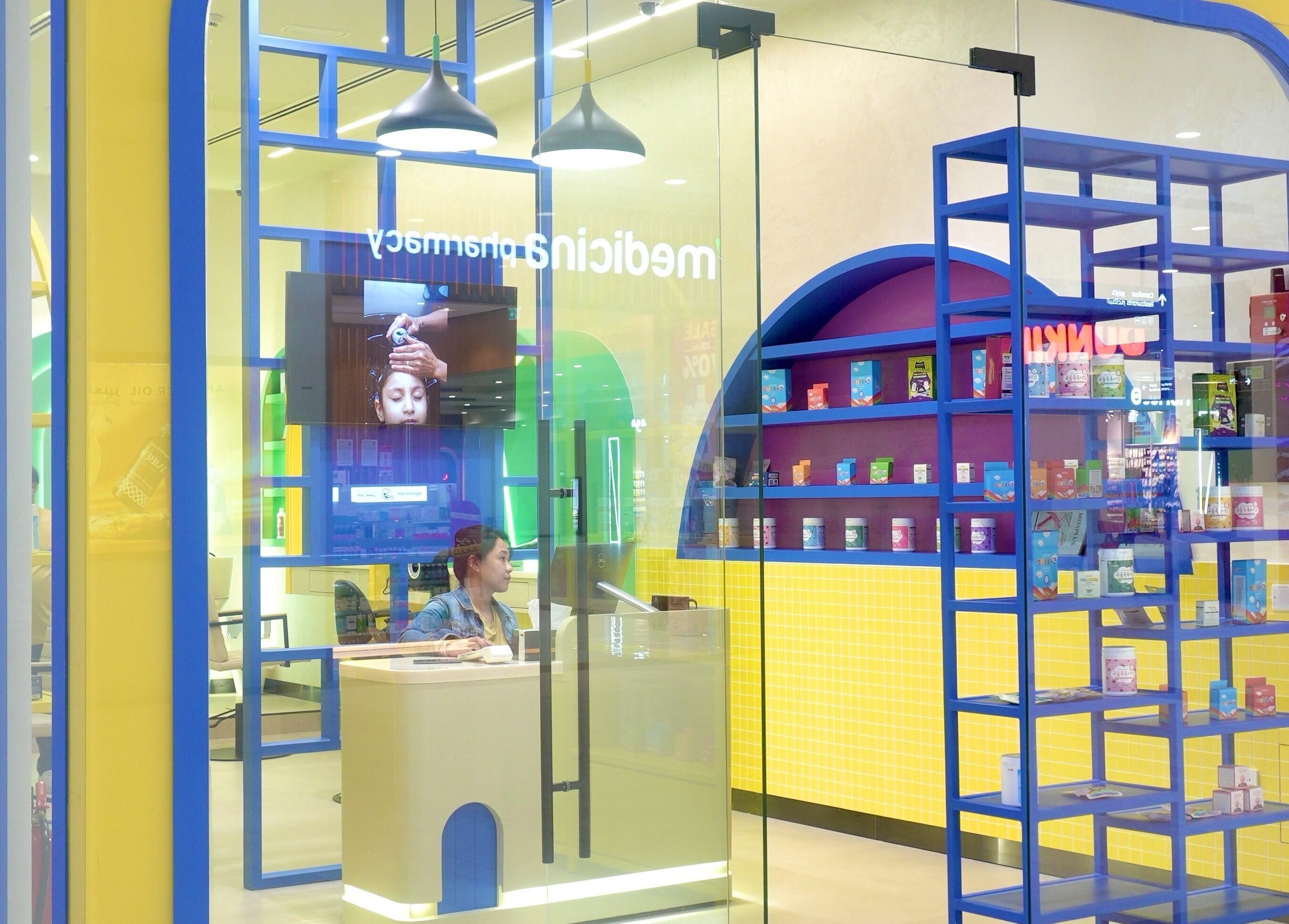 Bright interior of Stories Kids - Mohamed Bin Zayed in Abu Dhabi, featuring colorful shelves and modern decor.