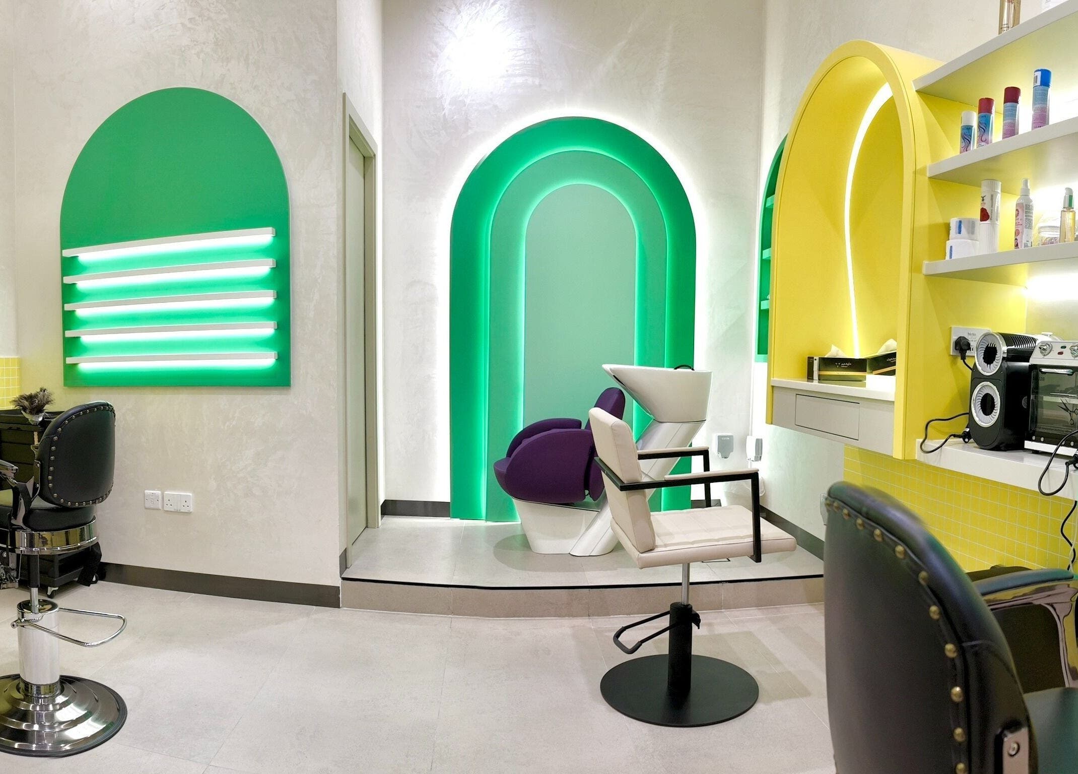 Bright salon at Stories Kids - Mohamed Bin Zayed, Abu Dhabi. Cheerful decor and modern styling stations.