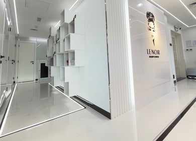 Sleek white hallway at Le Noir Beauty Center, Abu Dhabi, Abu Dhabi, AE showcasing modern design.