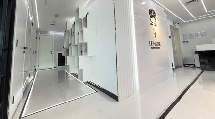 Sleek white hallway at Le Noir Beauty Center, Abu Dhabi, Abu Dhabi, AE showcasing modern design.