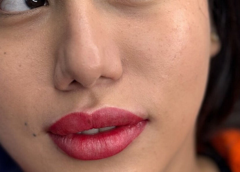 Close-up of a client's lips with expert makeup at Le Noir Beauty Center, Abu Dhabi, AE.