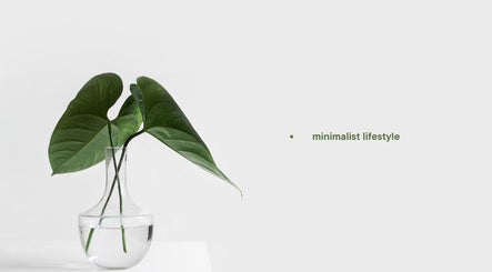 Elegant glass vase with green leaves at Belle Bleu Spa - Bluff, Bluff, Kwazulu-natal, ZA, emphasizing minimalism.