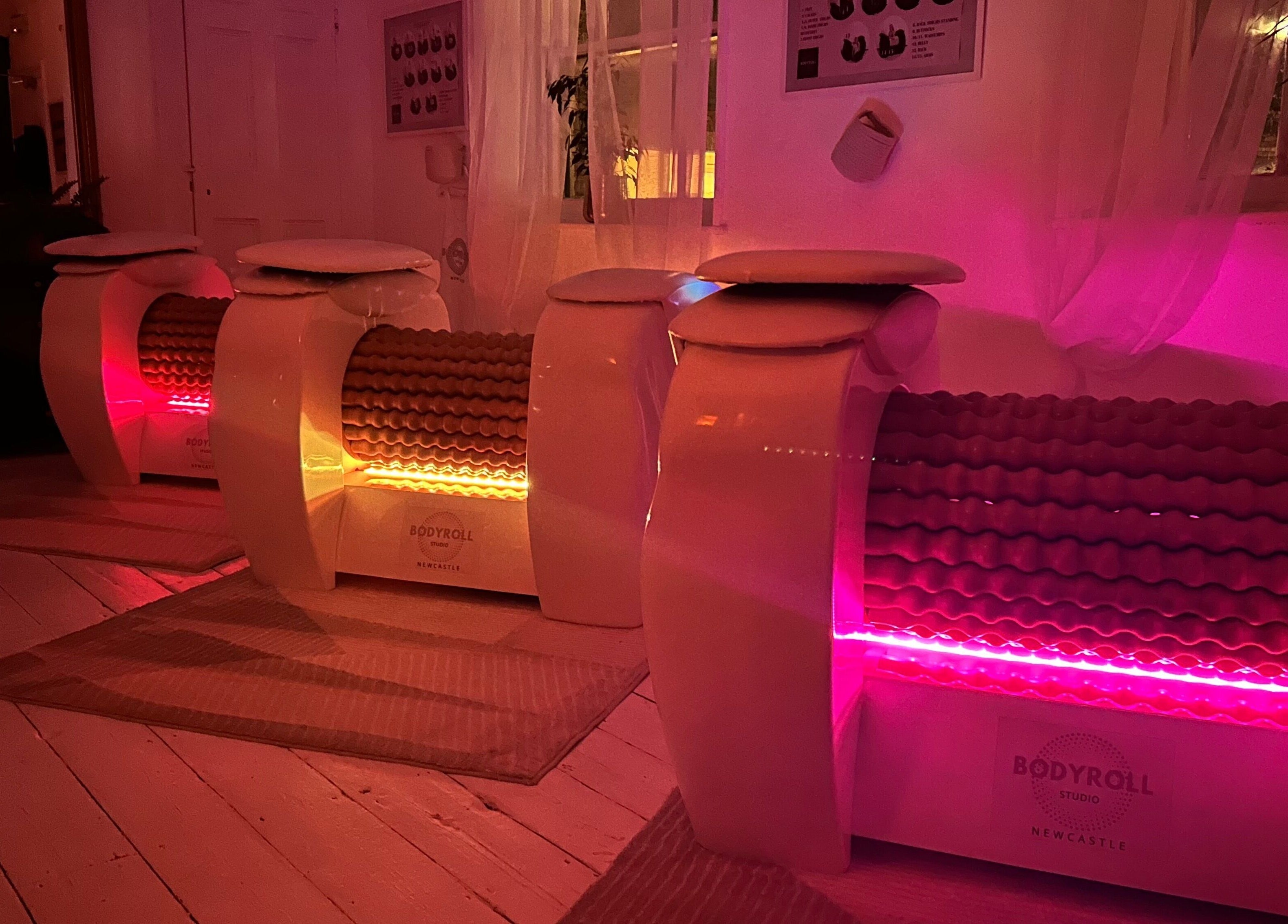 Bodyroll machines with pink lighting at Bodyroll Studio Newcastle Ltd, Newcastle upon Tyne, England, GB.